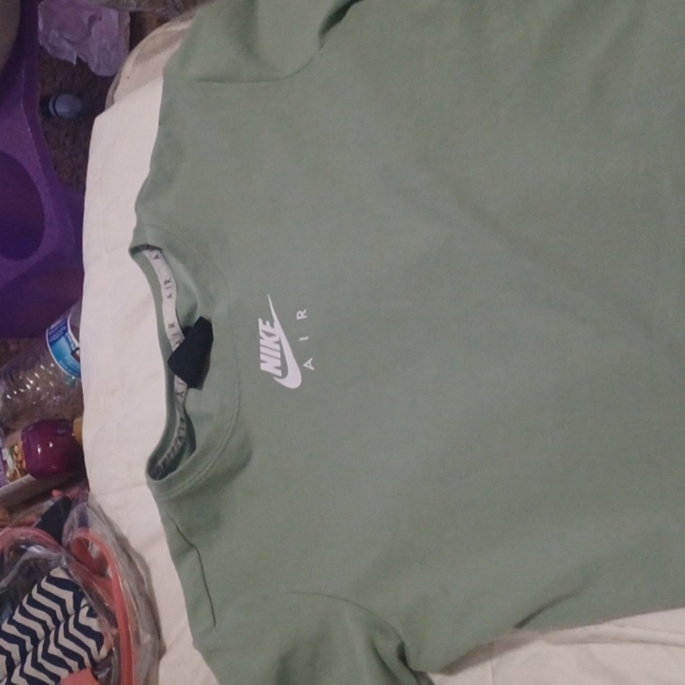 I'm selling a Nike Air crop top a medium it is green it is a casual shirt